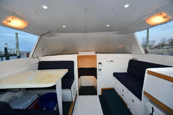 Slide: The Image of Interior of a 1965 Bertram Sportfisher boat with seating and table. - 15