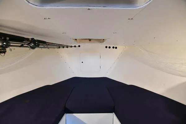 Slide: The Image of Interior cabin of a 1965 Bertram Sportfisher boat with fishing rods. - 20