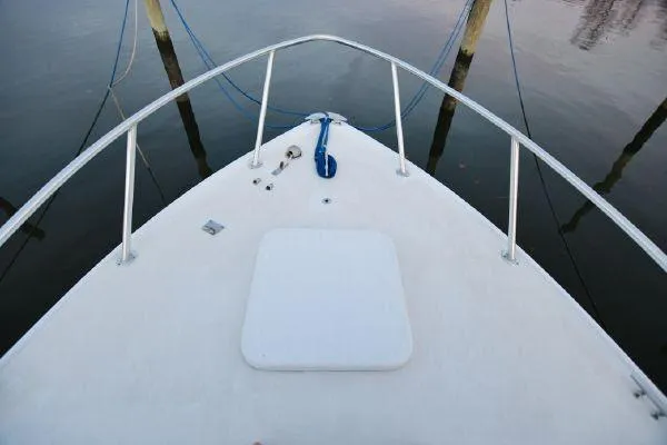 Slide: The Image of 1965 Bertram Sportfisher boat bow with railing and mooring lines. - 30