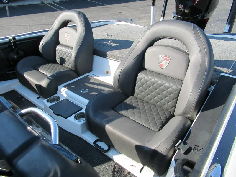 Slide: The Image of 2019 Triton 21 TrX Elite boat seats with quilted design and cup holders. - 4