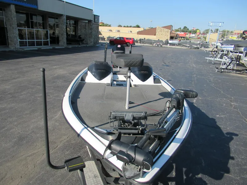 Slide: The Image of 2019 Triton 21 TrX Elite boat parked outdoors in a dealership lot. - 7