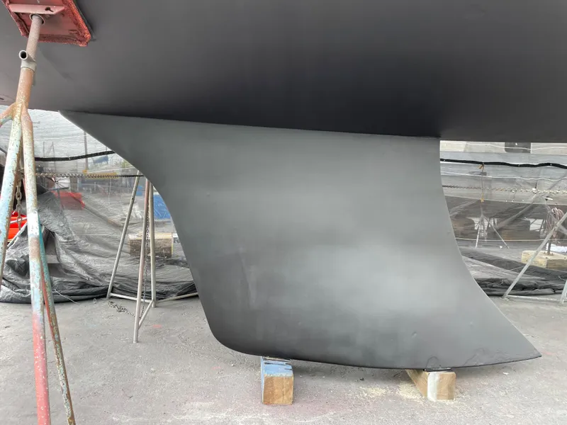 Slide: The Image of Keel of a 2000 Jeanneau 52.2 sailboat on dry dock. - 13
