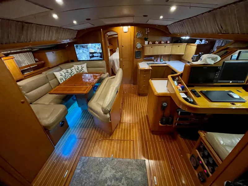 Slide: The Image of Luxurious interior of a 2000 Jeanneau 52.2 yacht with elegant wood finishes. - 20