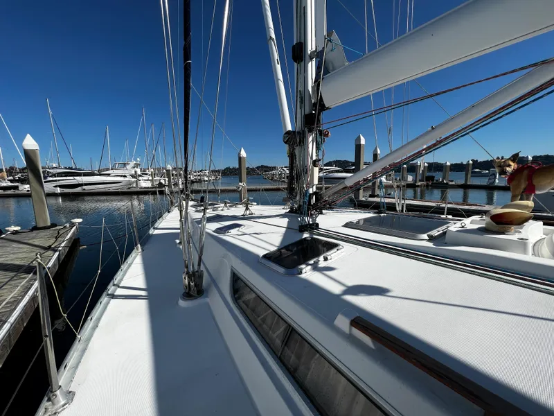 Slide: The Image of Jeanneau 52.2 sailboat docked at marina, clear blue sky, 2000 model. - 30