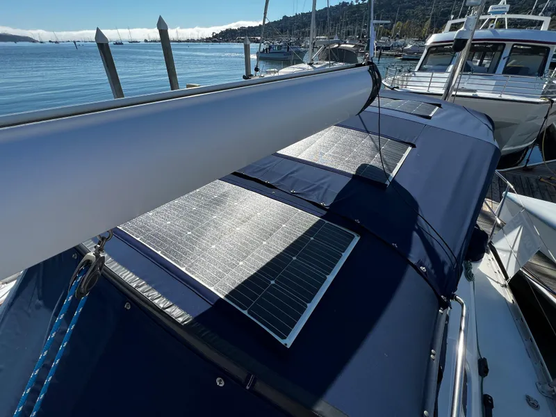 Slide: The Image of Sailboat Jeanneau 52.2 (2000) with solar panels docked at marina. - 31