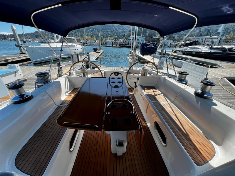 Slide: The Image of Cockpit of 2000 Jeanneau 52.2 sailboat with dual steering wheels and wooden deck. - 33
