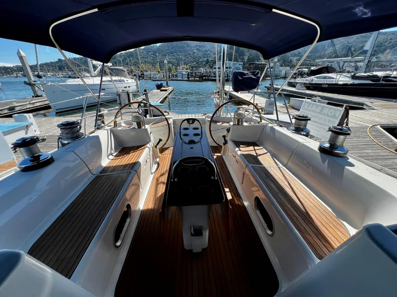 Slide: The Image of Cockpit view of 2000 Jeanneau 52.2 sailboat docked at marina. - 34