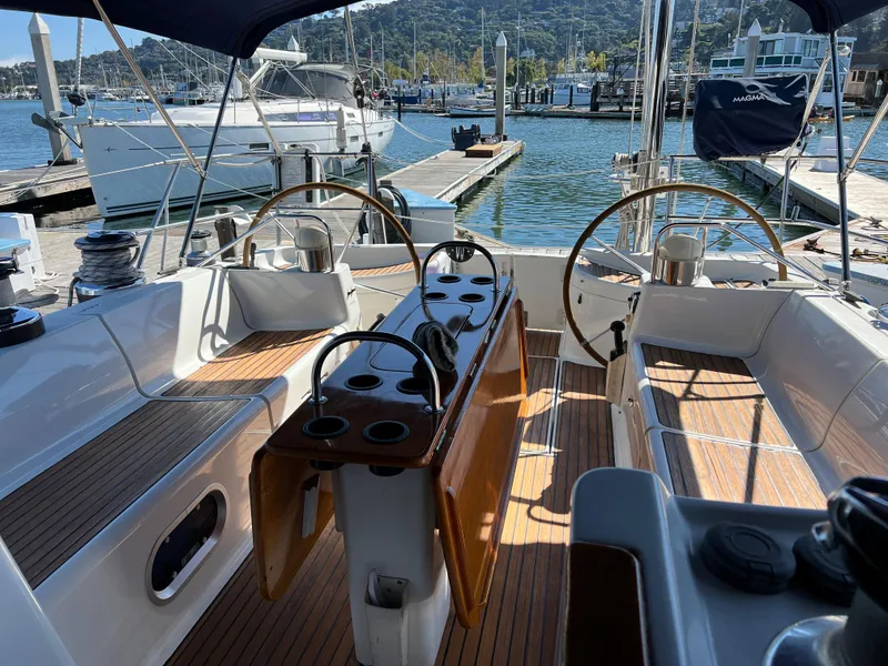 Slide: The Image of Cockpit of 2000 Jeanneau 52.2 sailboat with dual steering wheels at marina. - 38