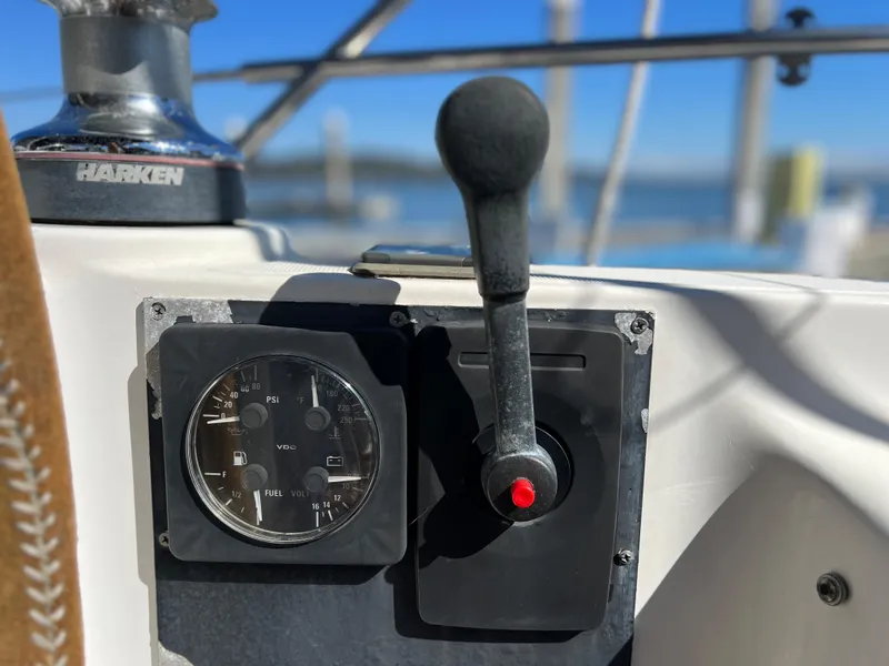 Slide: The Image of Control panel of a 2000 Jeanneau 52.2 sailboat with throttle lever and gauge. - 43