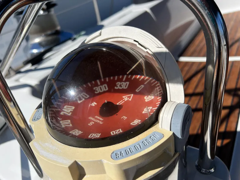 Slide: The Image of Compass on Jeanneau 52.2 sailboat, 2000 model, showing navigation details. - 44