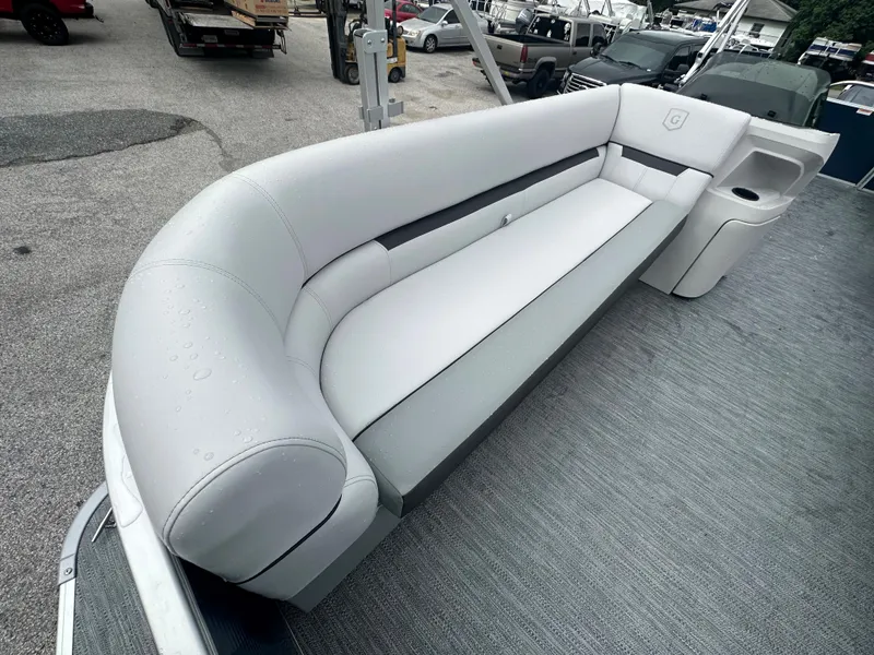 Slide: The Image of 2024 Sweetwater 2286 SB boat with sleek gray seating and modern design. - 13
