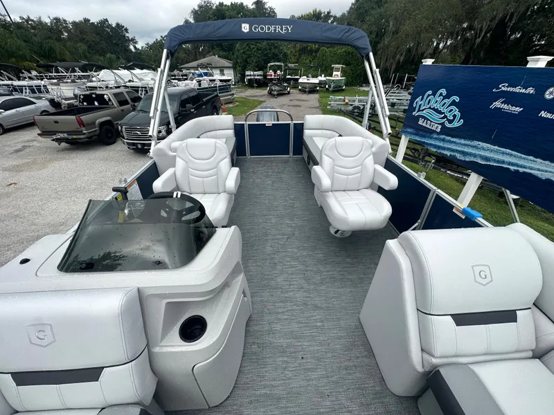 Slide: The Image of 2024 Sweetwater 2286 SB pontoon boat with spacious seating and modern design. - 6