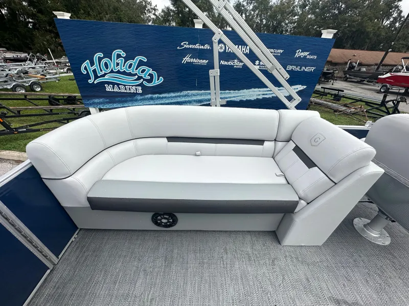 Slide: The Image of 2024 Sweetwater 2286 SB boat with white and gray seating at Holiday Marine. - 8
