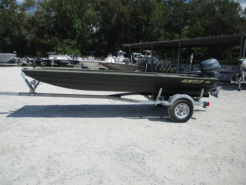 Slide: The Image of 2022 Alweld 1542 MARSH LF boat on trailer in outdoor lot. - 1