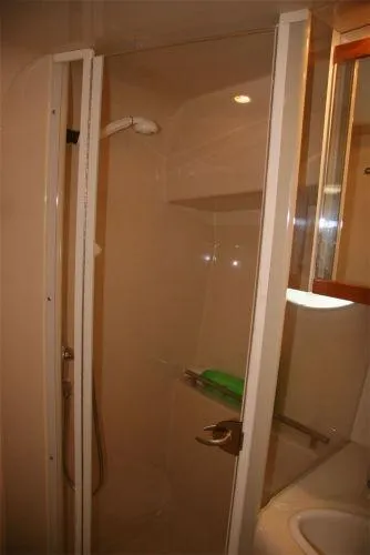 Slide: The Image of 2003 Maxum 3700 SCR yacht bathroom with glass shower enclosure. - 3
