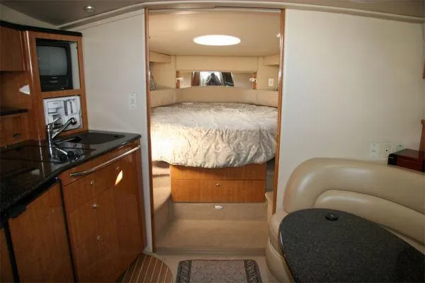 Slide: The Image of Interior of 2003 Maxum 3700 SCR yacht with cozy bedroom and kitchenette. - 7