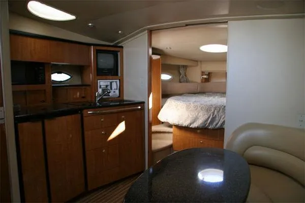 Slide: The Image of Interior of 2003 Maxum 3700 SCR yacht with kitchen and cozy bedroom. - 8