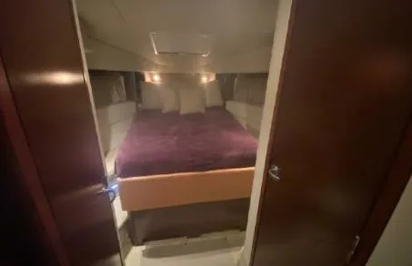 Slide: The Image of Cozy bedroom interior of 2007 Sea Ray 36 Sedan Bridge yacht. - 19