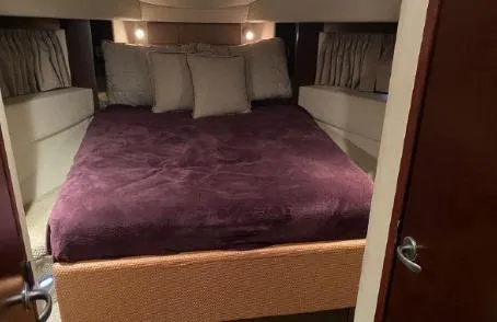 Slide: The Image of Luxurious bedroom interior of 2007 Sea Ray 36 Sedan Bridge yacht. - 20