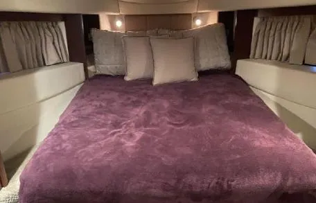 Slide: The Image of Luxurious bedroom interior of 2007 Sea Ray 36 Sedan Bridge yacht. - 21