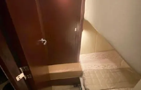 Slide: The Image of Interior cabin of 2007 Sea Ray 36 Sedan Bridge with wooden door and cozy bed. - 25