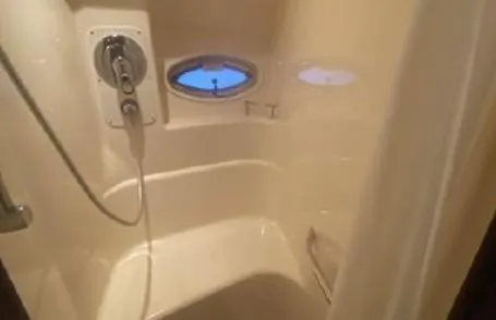 Slide: The Image of Shower area in 2007 Sea Ray 36 Sedan Bridge yacht with porthole window. - 29