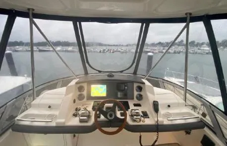 Slide: The Image of 2007 Sea Ray 36 Sedan Bridge helm with navigation system and marina view. - 3