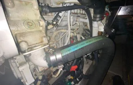 Slide: The Image of Engine compartment of 2007 Sea Ray 36 Sedan Bridge with visible hoses and components. - 35