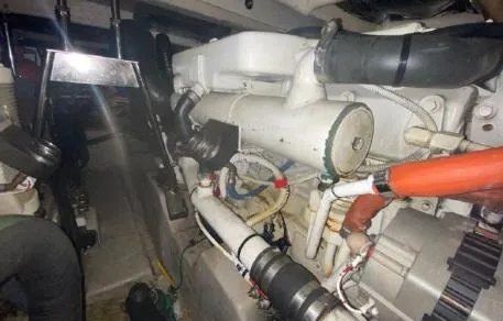 Slide: The Image of Engine compartment of 2007 Sea Ray 36 Sedan Bridge, showcasing mechanical components and piping. - 36