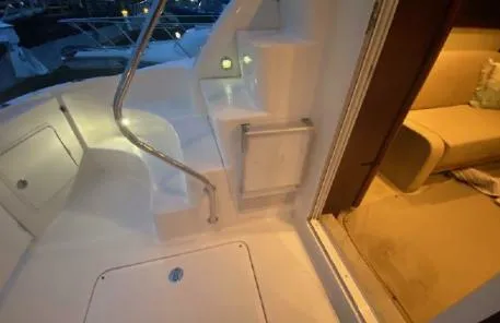 Slide: The Image of 2007 Sea Ray 36 Sedan Bridge yacht interior with stairs and seating area. - 38