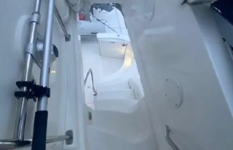 Slide: The Image of 2007 Sea Ray 36 Sedan Bridge interior with white steps and railing. - 4