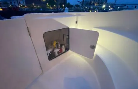 Slide: The Image of Storage compartment on 2007 Sea Ray 36 Sedan Bridge boat, open with supplies inside. - 41