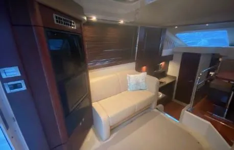 Slide: The Image of Interior of 2007 Sea Ray 36 Sedan Bridge with beige sofa and modern design. - 8
