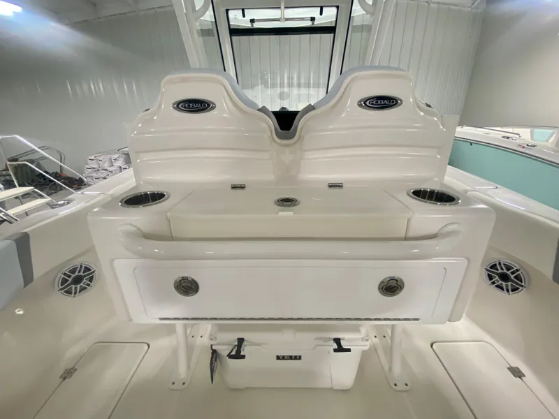 Slide: The Image of 2026 Robalo R250 boat interior with seating and storage compartments. - 15