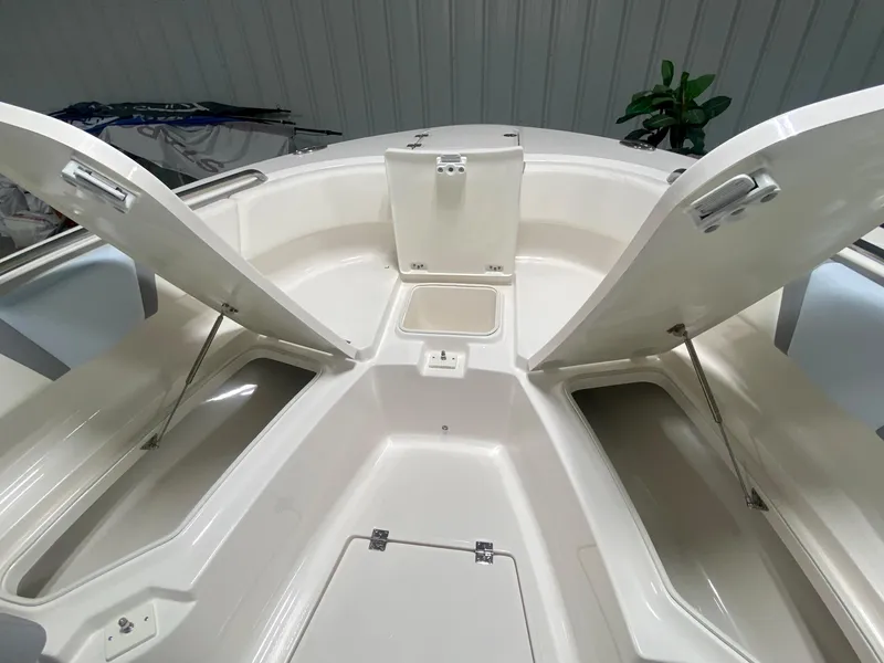Slide: The Image of 2026 Robalo R250 boat interior with open storage compartments. - 32