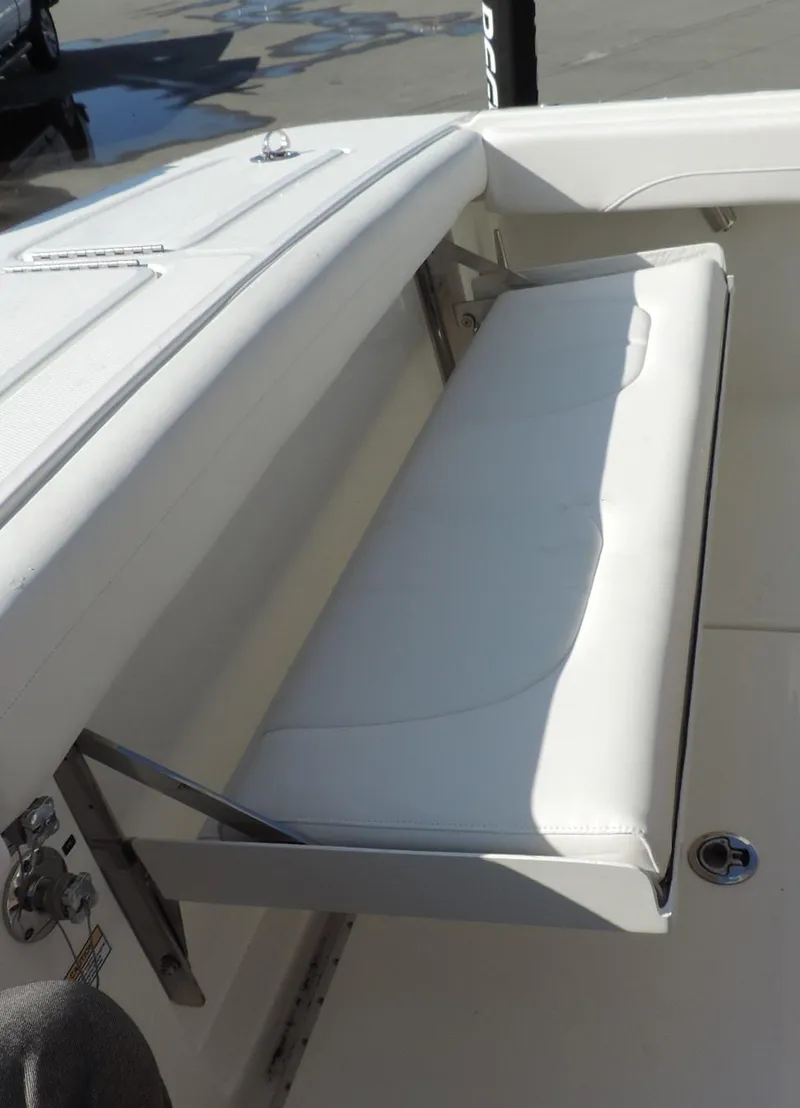Slide: The Image of 2024 Regulator 23 Center Console boat with foldable white bench seat. - 11