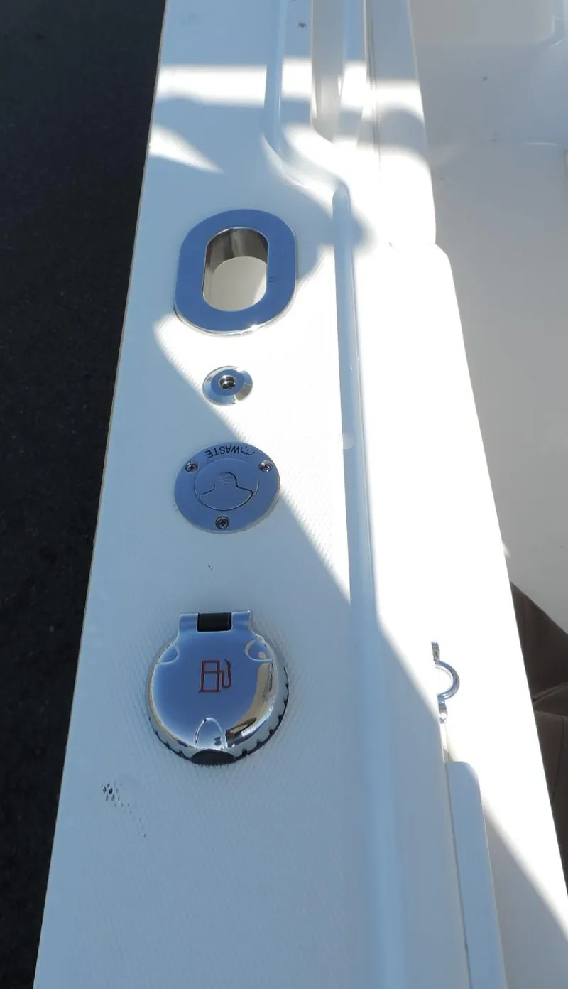 Slide: The Image of 2024 Regulator 23 Center Console boat deck with chrome fittings and fixtures. - 15