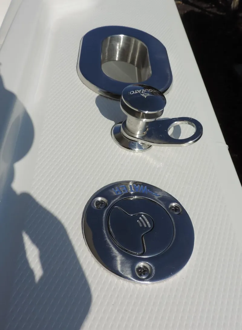 Slide: The Image of 2024 Regulator 23 Center Console boat hardware detail, featuring stainless steel fittings. - 16