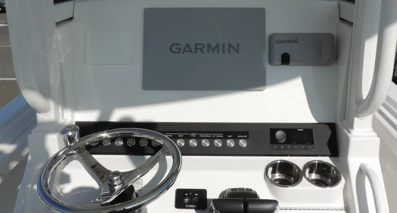 Slide: The Image of 2024 Regulator 23 Center Console dashboard with Garmin navigation system and steering wheel. - 19