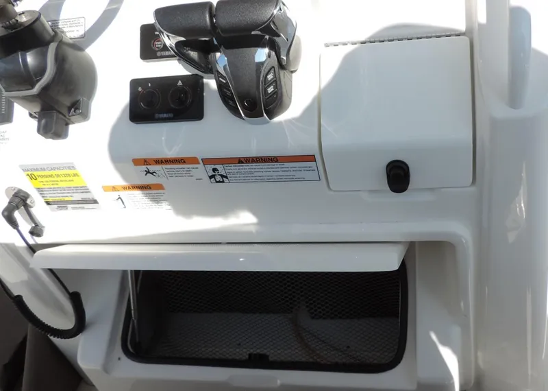 Slide: The Image of 2024 Regulator 23 Center Console dashboard with controls and storage compartment. - 20