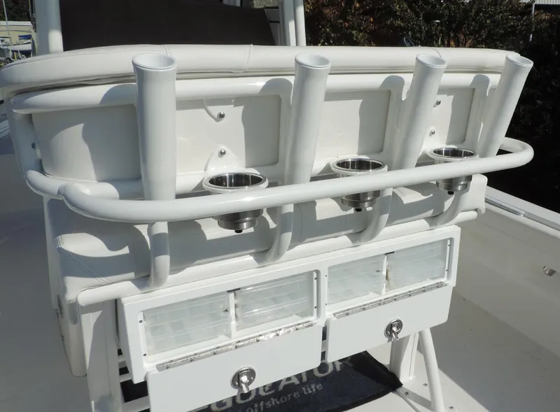 Slide: The Image of 2024 Regulator 23 Center Console boat with rod holders and storage compartments. - 22