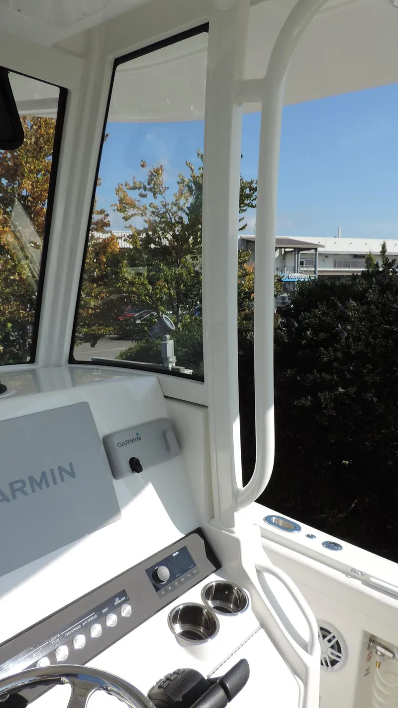 Slide: The Image of 2024 Regulator 23 Center Console interior with Garmin navigation system. - 23