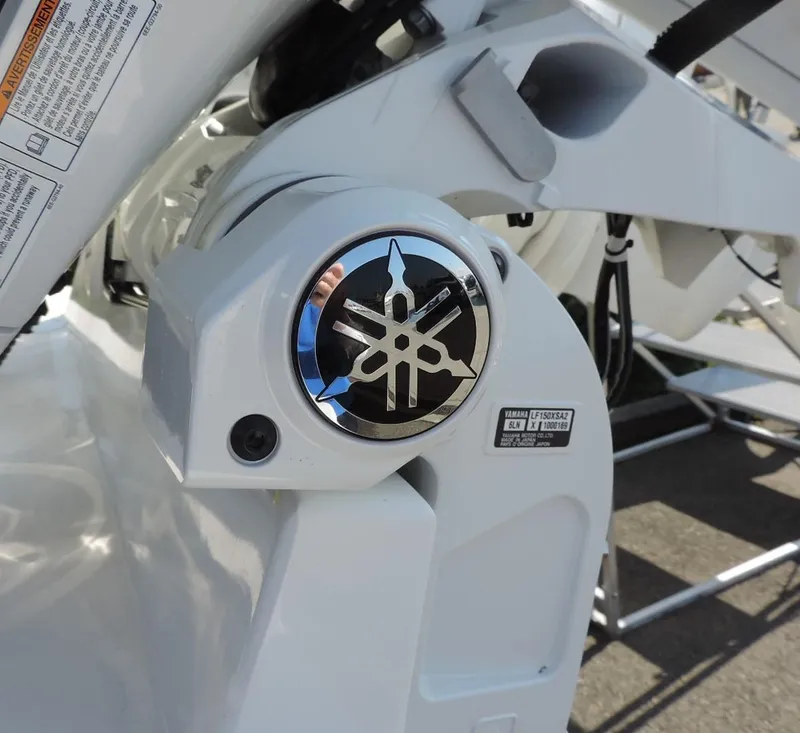 Slide: The Image of 2024 Regulator 23 Center Console boat with Yamaha engine detail. - 6