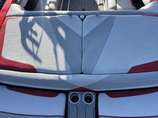 Slide: The Image of 2017 Malibu 23 LSV boat interior with red and gray upholstery. - 6