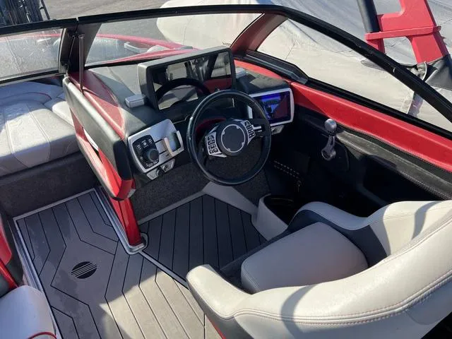 Slide: The Image of 2017 Malibu 23 LSV boat interior with modern dashboard and steering wheel. - 8