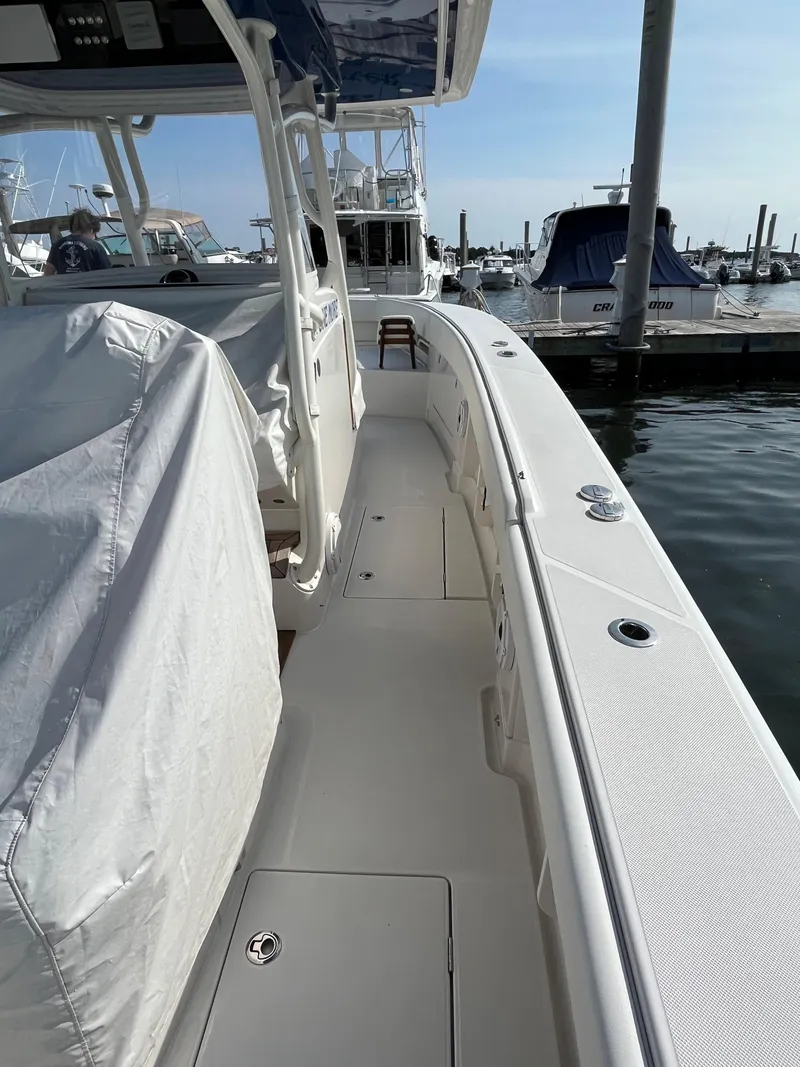 Slide: The Image of 2020 Jupiter 34 Center Console boat docked at marina. - 11