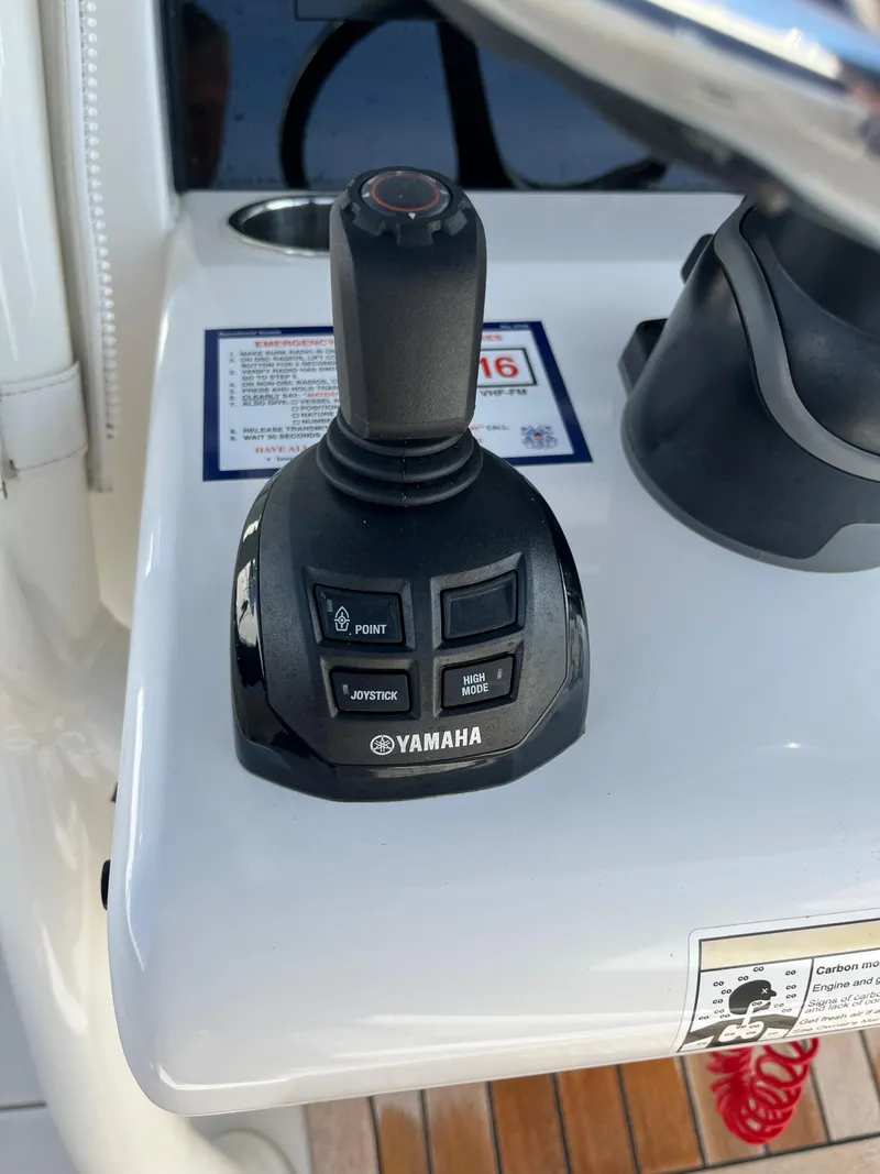 Slide: The Image of Yamaha joystick control on 2020 Jupiter 34 Center Console boat dashboard. - 20