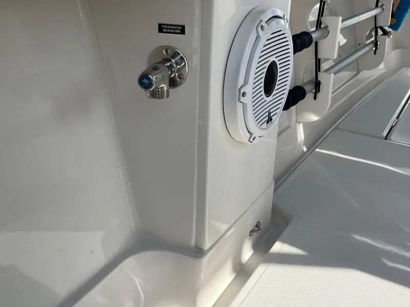 Slide: The Image of 2020 Jupiter 34 Center Console boat interior with speaker and fishing rod holders. - 31