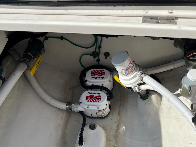 Slide: The Image of 2020 Jupiter 34 Center Console bilge area with Rule-Mate 2000 pumps and hoses. - 33
