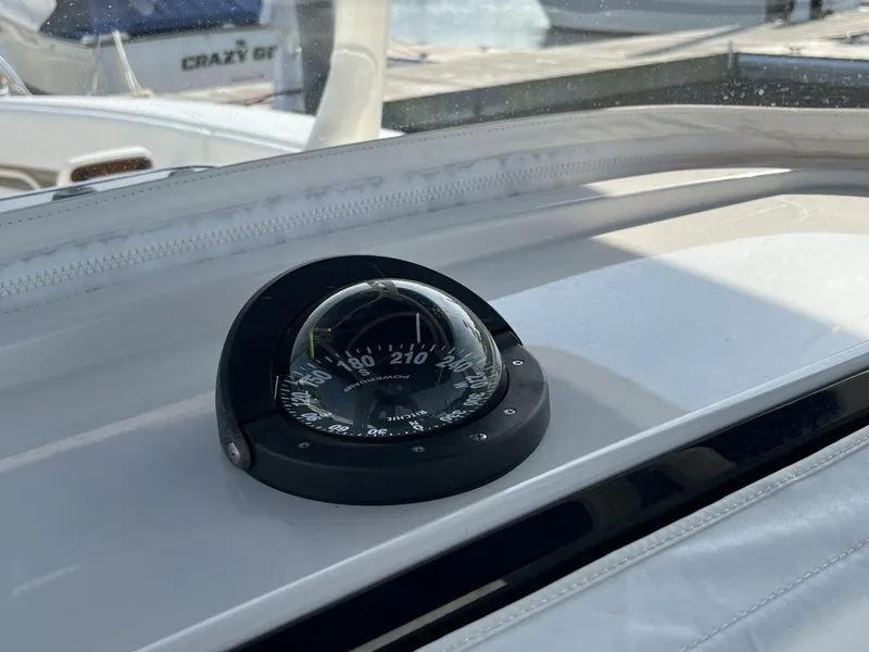 Slide: The Image of Compass on 2020 Jupiter 34 Center Console boat dashboard, docked at marina. - 37
